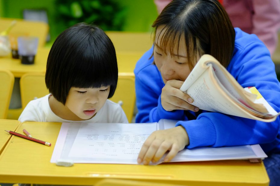 expert chinese tuition teacher teaching a child